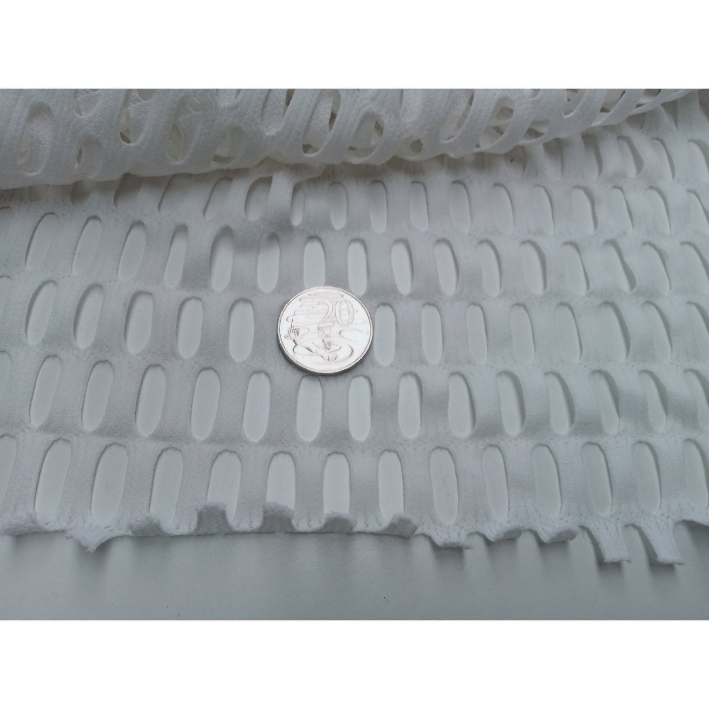 Laser cut stretch fabric -white sold by 1/2mtr