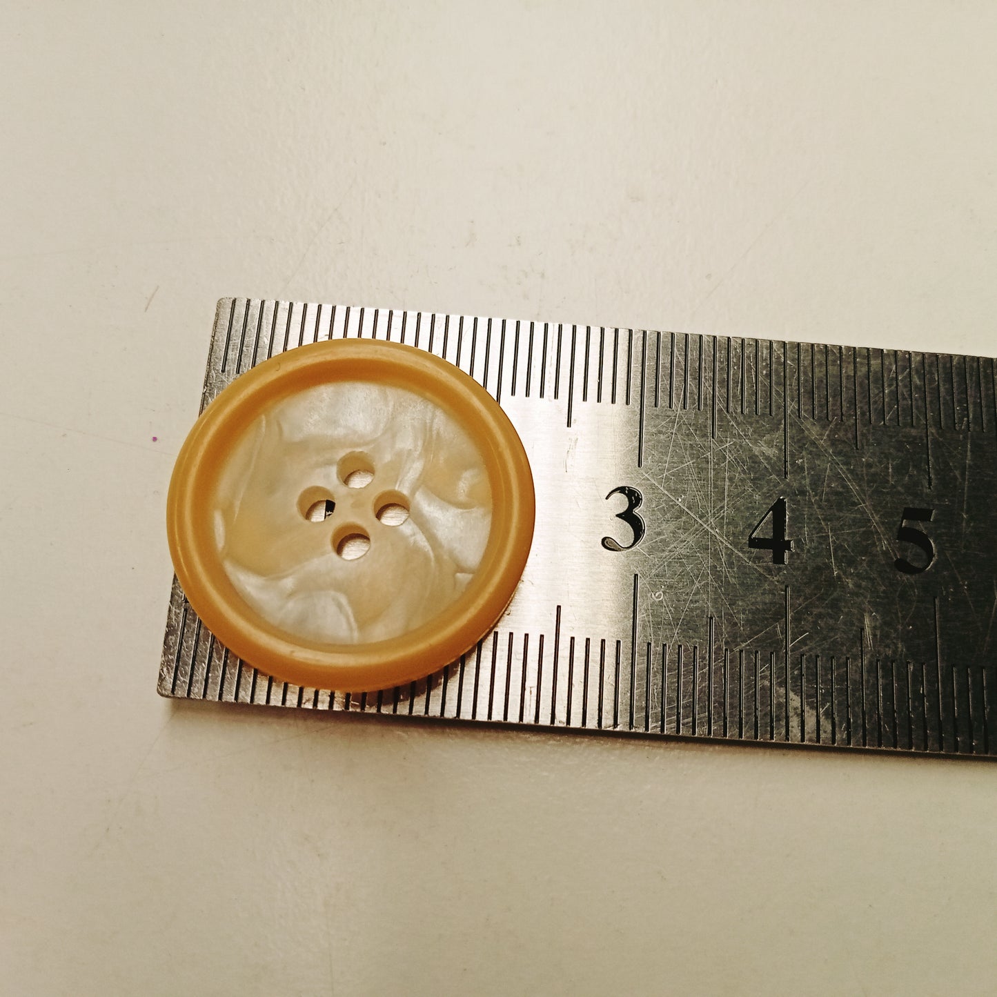 Pearl/honey shade 4 hole button