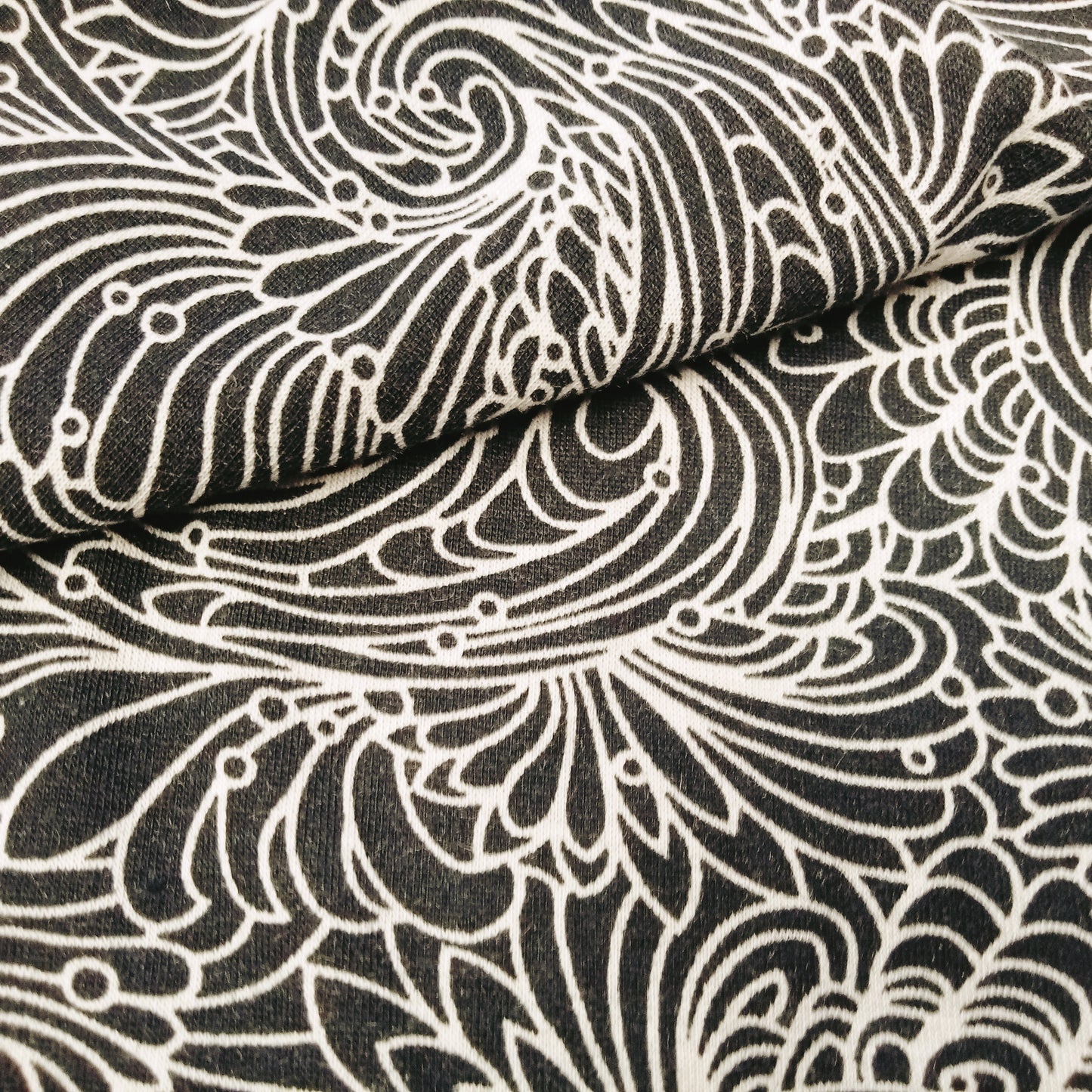 paisley printed knit jersey - sold by 1/2mtr