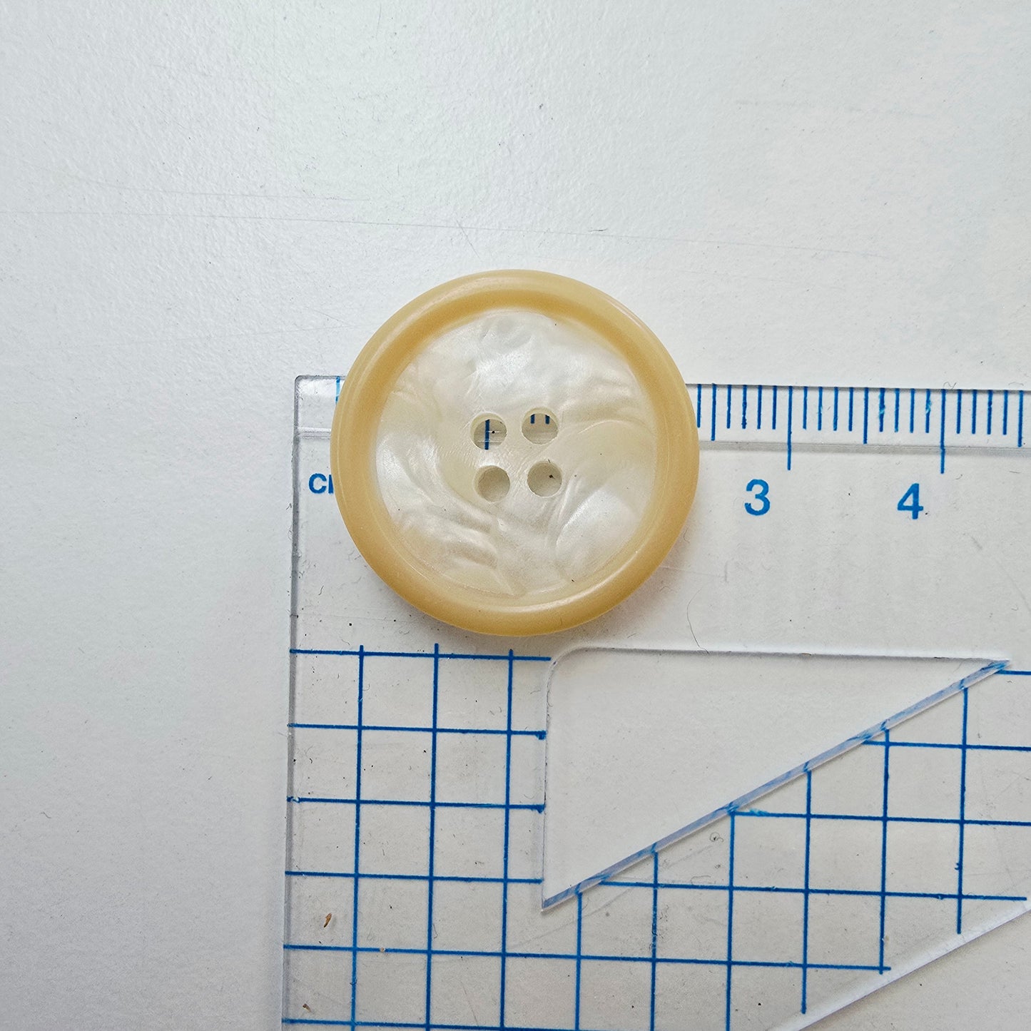Pearl/honey shade 4 hole button