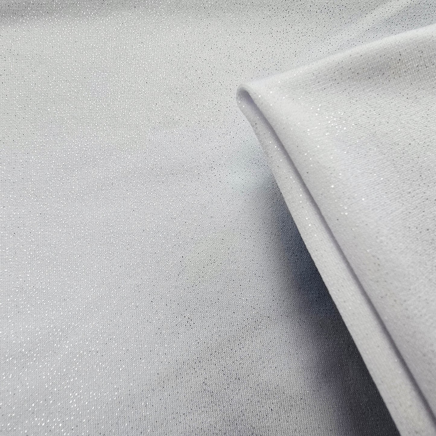 Capri-white silver foil jersey - sold by 1/2mtr